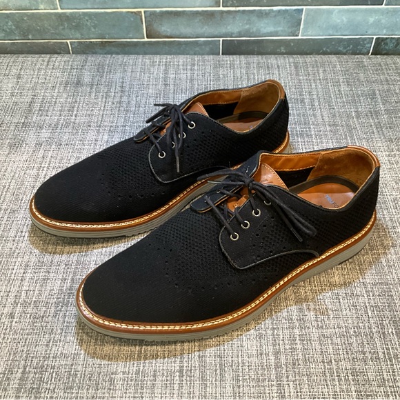 Johnston & Murphy Men\'s Upton Knit Wingtip shoes in black knit.